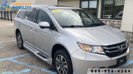 Used Wheelchair Van For Sale: 2014 Honda Odyssey Touring Wheelchair Accessible Van For Sale with a BraunAbility Honda Entervan II on it. VIN: 5FNRL5H99EB068031