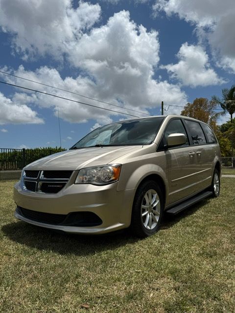 Used Wheelchair Van For Sale: 2014 Dodge Caravan  Wheelchair Accessible Van For Sale with a AutoAbility Wheelchair Van Conversions - Rear Entry Dodge on it. VIN: 2C4RDGCG6ER205283