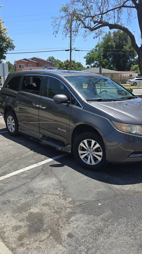 Used Wheelchair Van For Sale: 2015 Honda Odyssey EX-L Mobility Handicap Van Wheelchair Accessible Van For Sale with a BraunAbility - Honda Power Infloor on it. VIN: 5FNRL5H64FB020928
