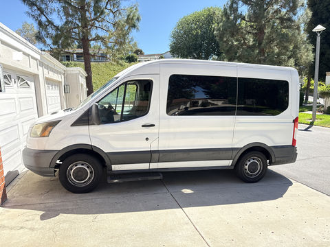 Used Wheelchair Van For Sale: 2015 Ford T-150 XL w/Medium Roof w/Sliding Side Door Van Wheelchair Accessible Van For Sale with a Nor-Cal Vans - NCV Commercial Wheelchair Transit on it. VIN: 1FMZK1CMXFKA27723