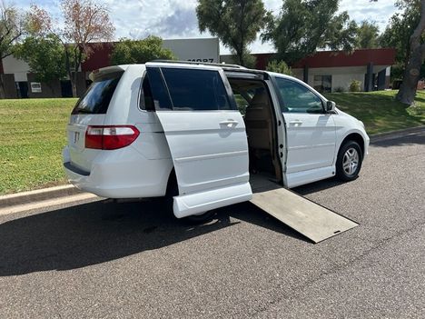 Used Wheelchair Van For Sale: 2007 Honda Odyssey EX Wheelchair Accessible Van For Sale with a Ramp Wheelchair Mobility Van on it. VIN: 5FNRL38477B095451