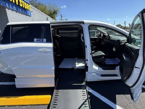 New Wheelchair Van For Sale: 2026 Honda Odyssey Elite Wheelchair Accessible Van For Sale with a BraunAbility Honda Power Infloor on it. VIN: 047754