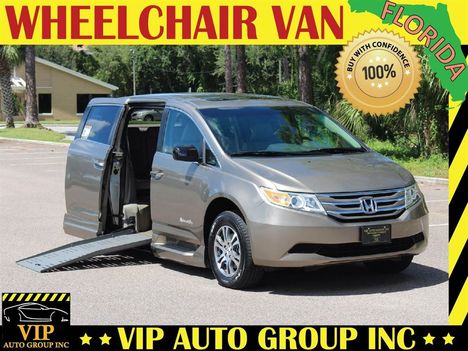 Used Wheelchair Van For Sale: 2011 Honda Odyssey EX-L Wheelchair Accessible Van For Sale with a BraunAbility Side Entry Power Ramp on it. VIN: 5FNRL5H60BB066847